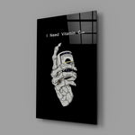 a skeleton hand gripping a roll of cash glass wall art angled to show the polished tempered glass panel