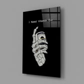 a skeleton hand gripping a roll of cash glass wall art angled to show the polished tempered glass panel