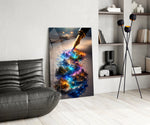 a fountain pen writing a glowing world glass wall art leaning beside a dark leather sofa