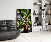 a rainbow tree canopy spiralling overhead glass wall art leaning beside a dark leather sofa