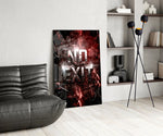 the words No Exit on cracked red stone glass wall art leaning beside a dark leather sofa