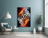 blackletter word in fire and smoke glass wall art styled above an armchair in a reading corner