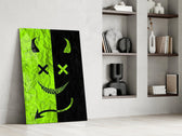 split neon green devil smiley panel resting in a shelving niche in a modern interior