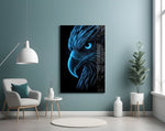 glowing blue eagle head on black glass wall art styled above an armchair in a reading corner
