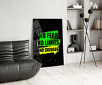 neon green gym motivation typography glass wall art leaning beside a dark leather sofa