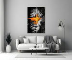 orange lava rift and lone figure panel bringing character to a minimalist living room wall