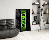 acid green stencil band on distressed black glass wall art leaning beside a dark leather sofa