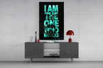 turquoise word stack hiding a face glass wall art displayed above a console in a designer interior