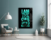 turquoise word stack hiding a face glass wall art styled above an armchair in a reading corner