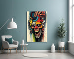 layered faces around a screaming skull glass wall art styled above an armchair in a reading corner