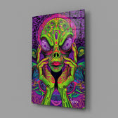 neon green alien face among mushrooms glass wall art angled to show the polished tempered glass panel