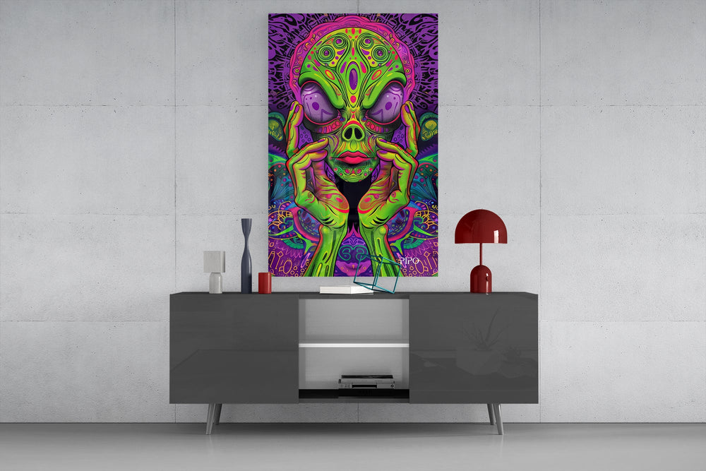 neon green alien face among mushrooms glass wall art displayed above a console in a designer interior