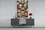 stacked sepia theatre masks glass wall art displayed above a console in a designer interior