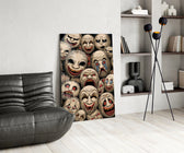 stacked sepia theatre masks glass wall art leaning beside a dark leather sofa