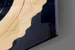 Close-up detail of the thin gold orbit rings and scattered star points on the glass surface
