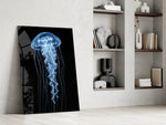a blue jellyfish in black water panel resting in a shelving niche in a modern interior