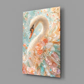 a white swan among peach and mint blossoms glass wall art angled to show the polished tempered glass panel