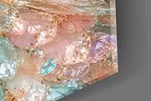 Close-up detail of the crystal tail feathers and coral peonies at the breast on the glass surface