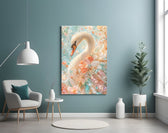 a white swan among peach and mint blossoms glass wall art styled above an armchair in a reading corner