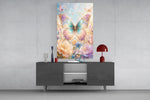 an iridescent butterfly over pastel flowers glass wall art displayed above a console in a designer interior