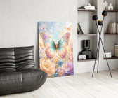 an iridescent butterfly over pastel flowers glass wall art leaning beside a dark leather sofa