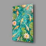 koi drifting through a turquoise lily pond glass wall art angled to show the polished tempered glass panel