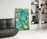 koi drifting through a turquoise lily pond glass wall art leaning beside a dark leather sofa
