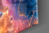 Close-up detail of the molten gold outlines and floating glass beads on the glass surface