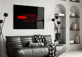 chaos loading red progress bar glass wall art styled above an armchair in a reading corner