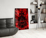 a skull-prowed pirate ship in a crimson storm glass wall art leaning beside a dark leather sofa