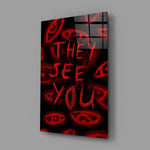 a red handwritten warning over watching eyes glass wall art angled to show the polished tempered glass panel