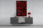 a red handwritten warning over watching eyes glass wall art displayed above a console in a designer interior