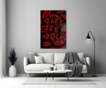 a red handwritten warning over watching eyes panel bringing character to a minimalist living room wall