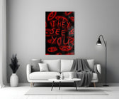 a red handwritten warning over watching eyes panel bringing character to a minimalist living room wall