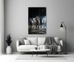 a herd of horses galloping through a storm panel bringing character to a minimalist living room wall