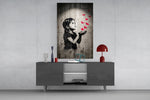 stencil girl releasing red paper cranes glass wall art displayed above a console in a designer interior