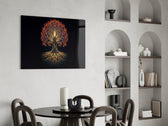 golden tree of life with glowing roots glass wall art leaning beside a dark leather sofa