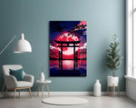 a torii gate before a crimson moon glass wall art styled above an armchair in a reading corner