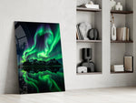 a green aurora over mirrored peaks panel resting in a shelving niche in a modern interior