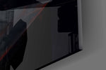 Close-up detail of the crimson shaft of light spilling across the floor on the glass surface