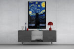 black cat at a starry night window glass wall art displayed above a console in a designer interior