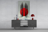 crimson sun behind bare poplars glass wall art displayed above a console in a designer interior
