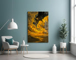 golden clouds and a crescent moon over desert dunes glass wall art styled above an armchair in a reading corner