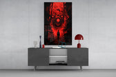 many-eyed monster over a red alley stairway glass wall art displayed above a console in a designer interior