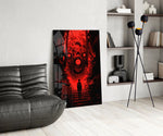 many-eyed monster over a red alley stairway glass wall art leaning beside a dark leather sofa