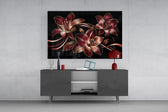 crimson and gold line-art lilies glass wall art styled in an atmospheric room setting