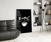 coffee energy formula humor glass wall art leaning beside a dark leather sofa