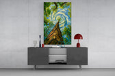 swirling sky through a treetop canopy glass wall art styled in an atmospheric room setting
