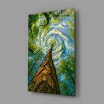 swirling sky through a treetop canopy glass wall art angled to show the polished tempered glass panel
