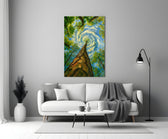 swirling sky through a treetop canopy panel bringing character to a minimalist living room wall
